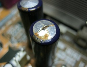 Bulged capacitor on a motherboard